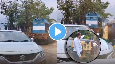 irctc news indian train stucked between vehicles in traffic jam in banaras watch viral video people says its happens only in india
