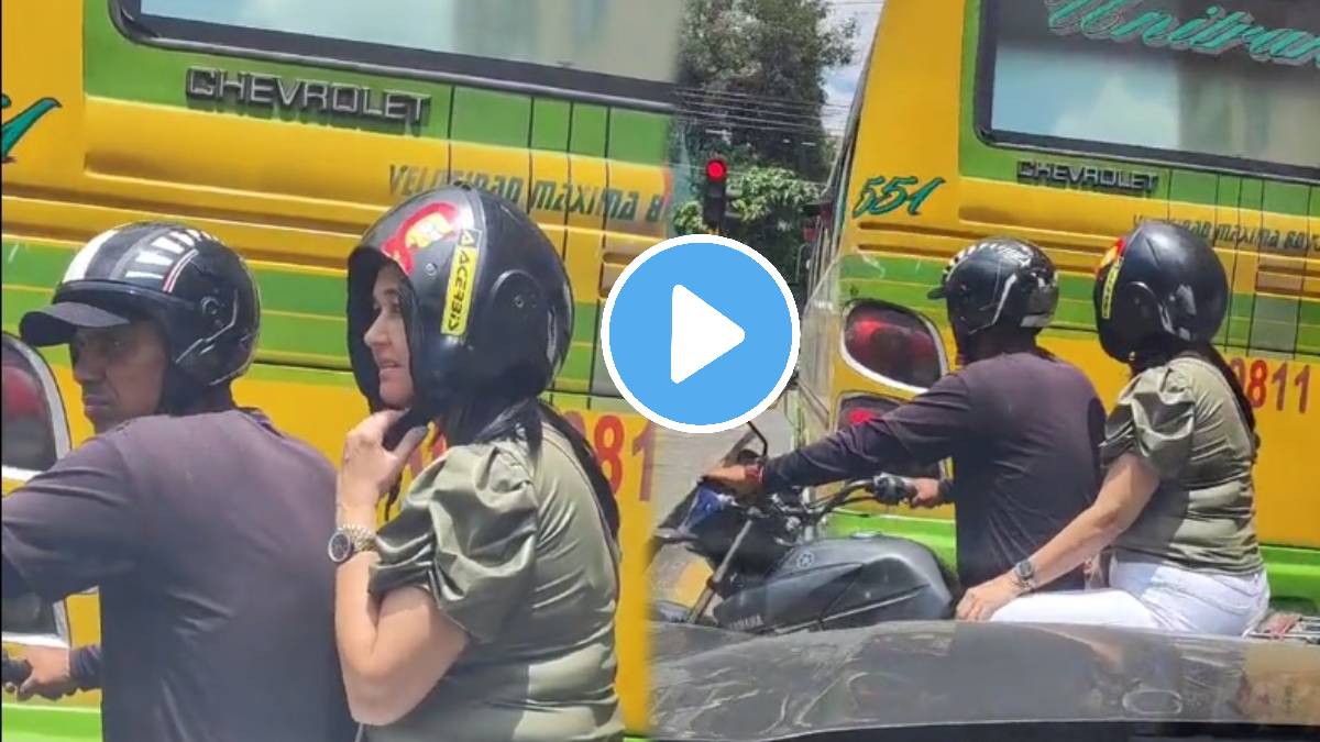 woman sit on bike and wearing wrong helmet video viral