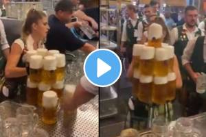 waitress carry 13 full beer glasses with two hands at once amazing balance video viral