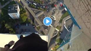 Boy performing a stunt by jumping on roof of a multi storey building shocking video viral on social media
