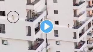 kid walks on edge of a building