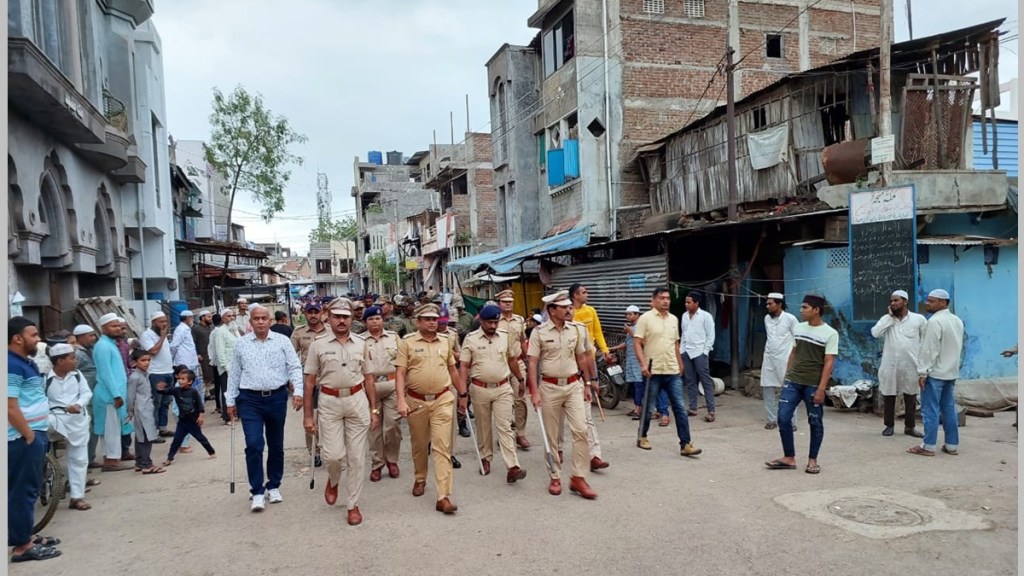 dhule police, dhule police marching on the road, law and order dhule, ganeshotsav 2023