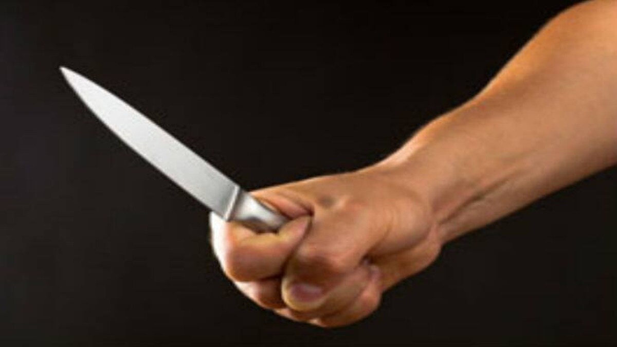 young man with knife going to administrative building of the ministry detained by police