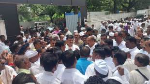 dr vijaykumar gavit surrounded by tribal activist