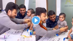 Doctor distracts child while giving injection