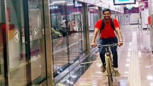 young man riding bicycle in a metro station