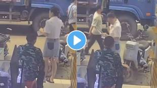 An unknown person sets fire to the skirt of a woman standing outside a shop