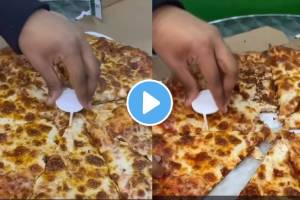 Demonstrated use of a pizza table for cutting pizza slices