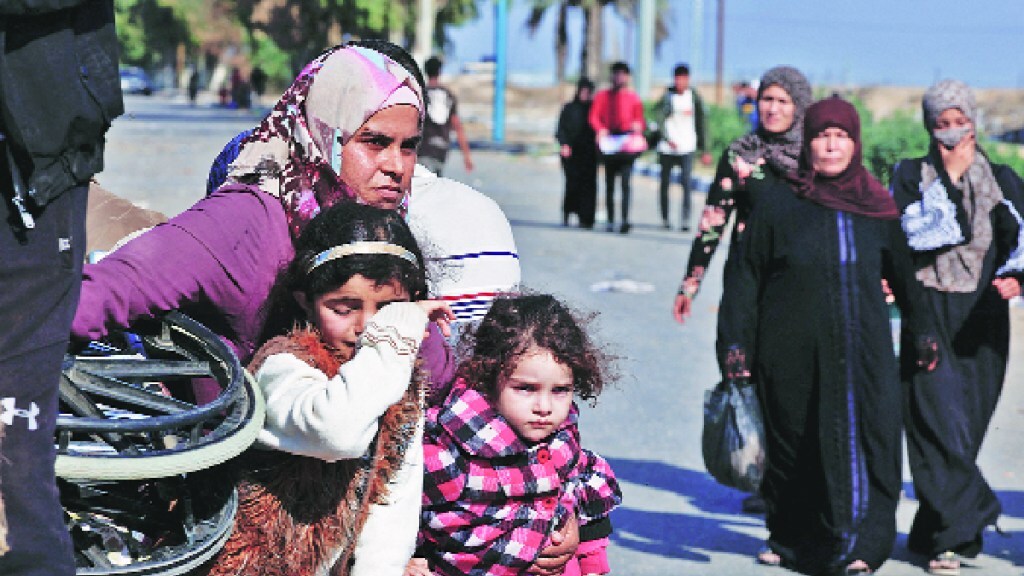 Evacuation of patients staff displaced from Shifa Hospital as Israel attacks targets in southern Gaza