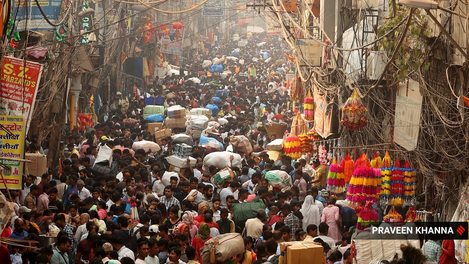 Over-crowded Sadar market ahead of Diwali in New Delhi on Monday. (Express Photo by Praveen Khanna)