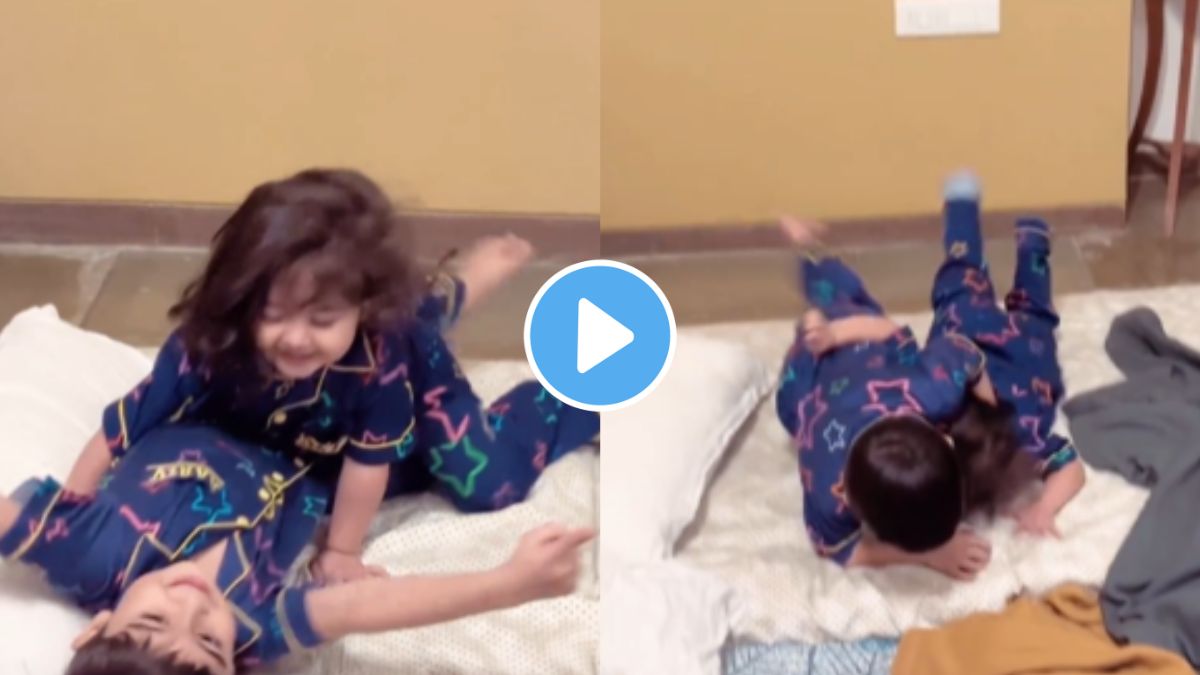 a child playing with his sister and enjoying fun video