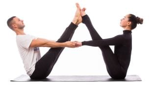 four couple yoga pose to stay fit together