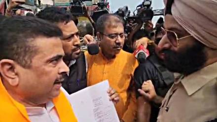 BJP leader Suvendu Adhikari (L) with IPS officer Jaspreet Singh (R). (Express)