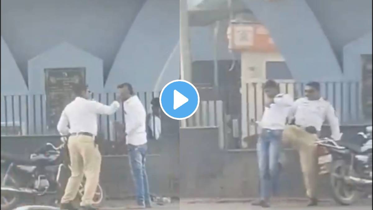 Police constable brutally beating a young man