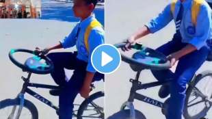 boy desi jugaad of placing car steering as cycles handle video goes viral on social media