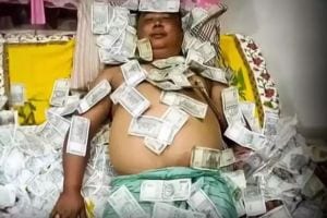 Benjamin Basumatary sleeping on cash