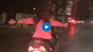 Girl Riding Hands Free Scooter On Road