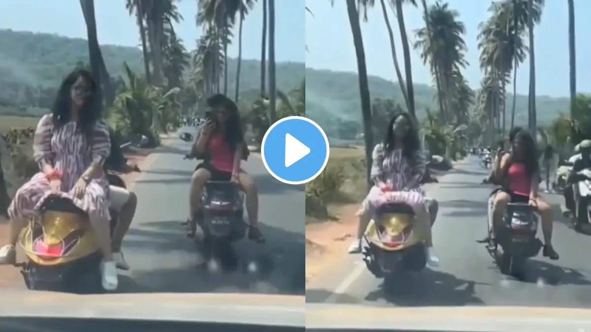 While Riding Famous Coconut Tree Road In Goa Two Girls Sit Opposite On Two Wheeler bike To Record Reels