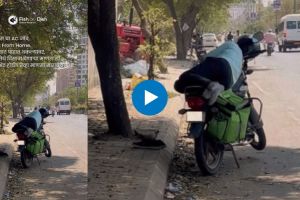 delivery boy slept on his bike,