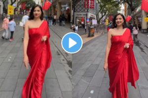 when woman walk on china streets wearing red saree