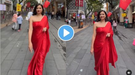 when woman walk on china streets wearing red saree