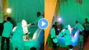 people washing plates in fountain in wedding