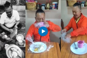 Man wraps utensils in plastic to avoid washing them.