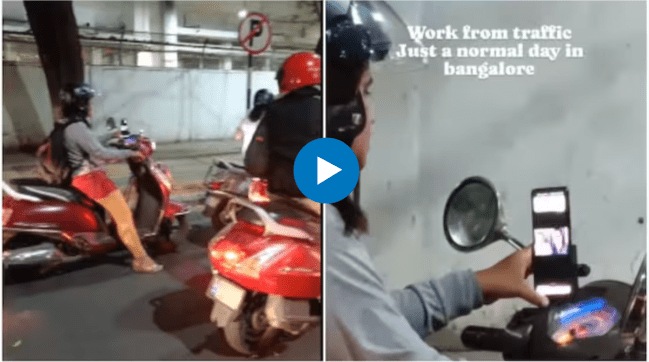 Woman attends online meeting on scooter amid traffic jam Watch