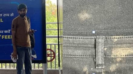 Delhi metro station man was chewing tobacco and stood behind Women on the escalator