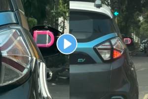 Viral Video electric car with broken side mirror man jugaad and attaching a plastic mirror in its place