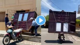 Mission Impossible Viral Video Seen Man carried a heavy wardrobe alone on a lonely scooter