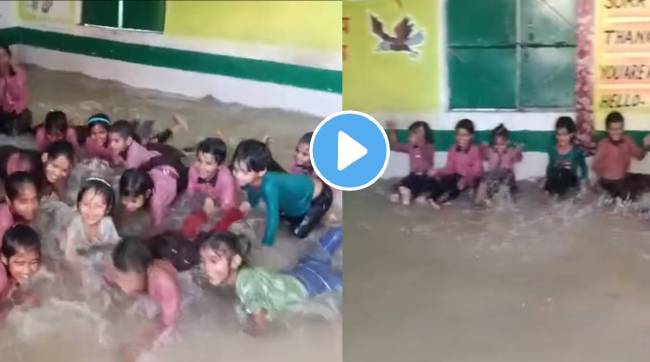 school teachers build an artificial pool in class students ecstatically enjoying swimming around their classroom