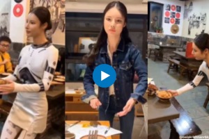 Is this waitress serving at a restaurant in China robot or human