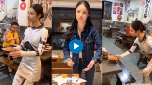 Is this waitress serving at a restaurant in China robot or human