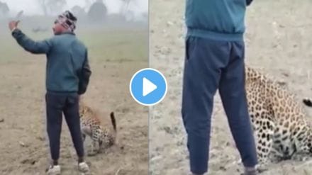 young Man takes selfie with leopard