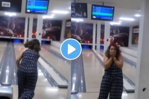 a woman broke the TV while playing bowling