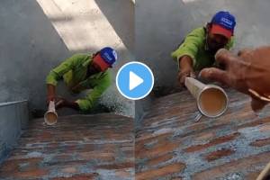 Viral Video The worker places cup of tea on wooden stick and slowly conveys the tea to the worker who sits at a little height