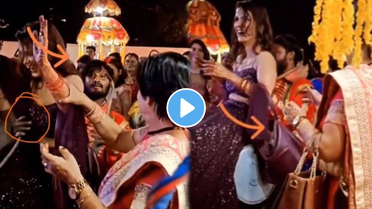 At the wedding ceremony the drummer grabbed the woman's waist