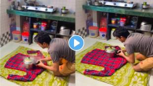 man using a hot cooker to iron shirts