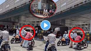 traffic police brutally beating man in the middle of the mumbai parel signal road due to break a traffic rule netizens angry reaction over poor video viral