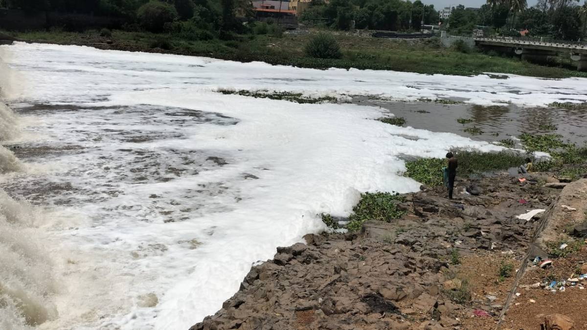 foam on the water of indrayani river ahead of palkhi ceremony