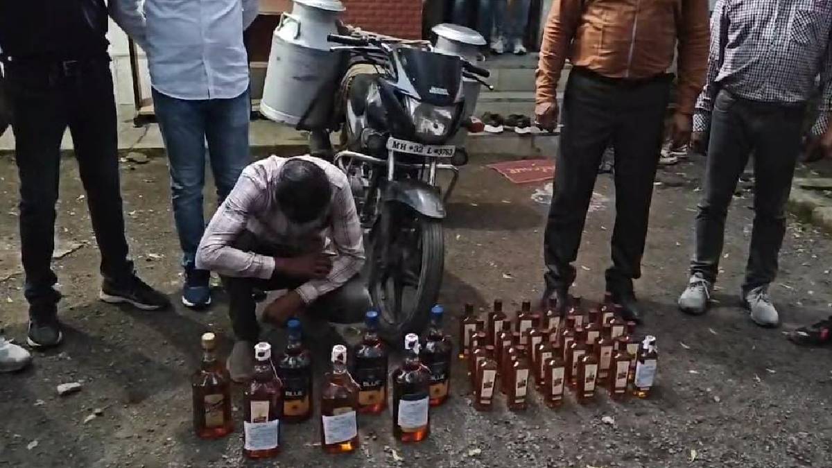 police arrested bike rider who smuggling liquor in milk cans