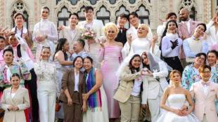 A group of LGBTQ pose for a picture as a part of celebration of a marriage equality bill at Government house in Bangkok, Thailand. (AP Photo)