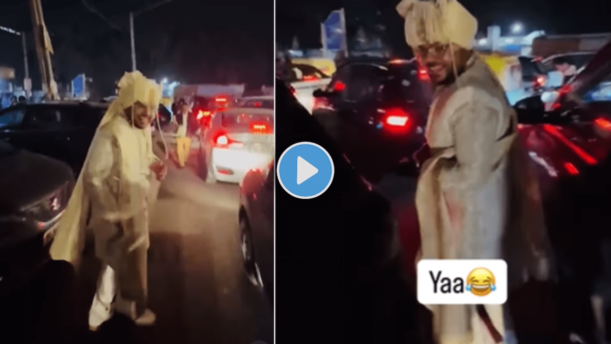 Groom walks through traffic to chase his Barat