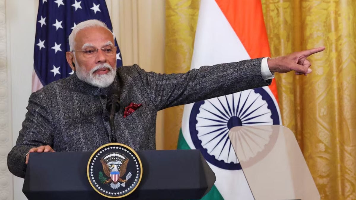 Prime Minister Narendra Modi addressing a question on Adani bribery charges during a press conference, emphasizing his commitment to every Indian.
