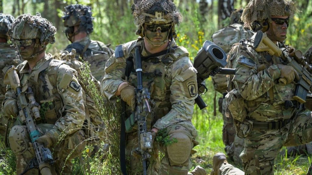 A photo showing the US Army emblem with a caption about the transgender ban following Donald Trump's executive order.