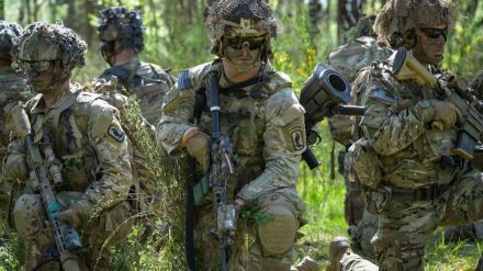 A photo showing the US Army emblem with a caption about the transgender ban following Donald Trump's executive order.