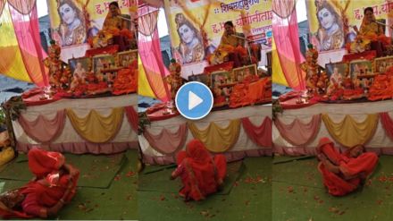 an old lady enjoy bhajan in a kirtan program