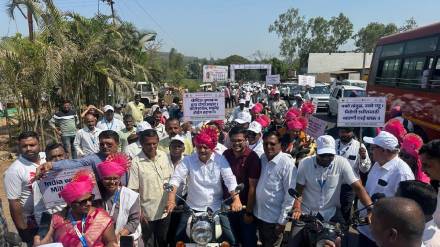 health minister prakash abitkar led rally promoting nutritious cereals encouraging others by riding bullet
