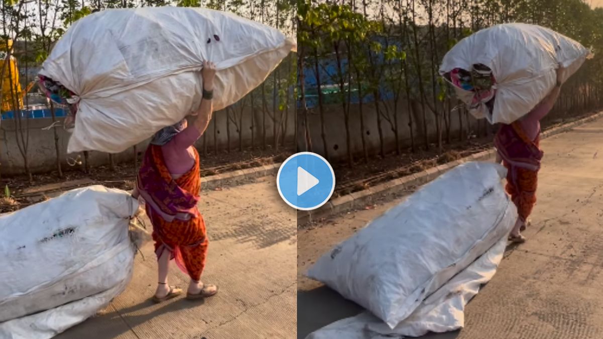 video of an old lady carry a load of garbage on her head